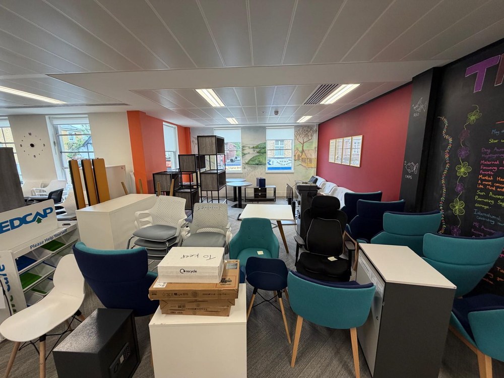 Office furniture and seating being moved out