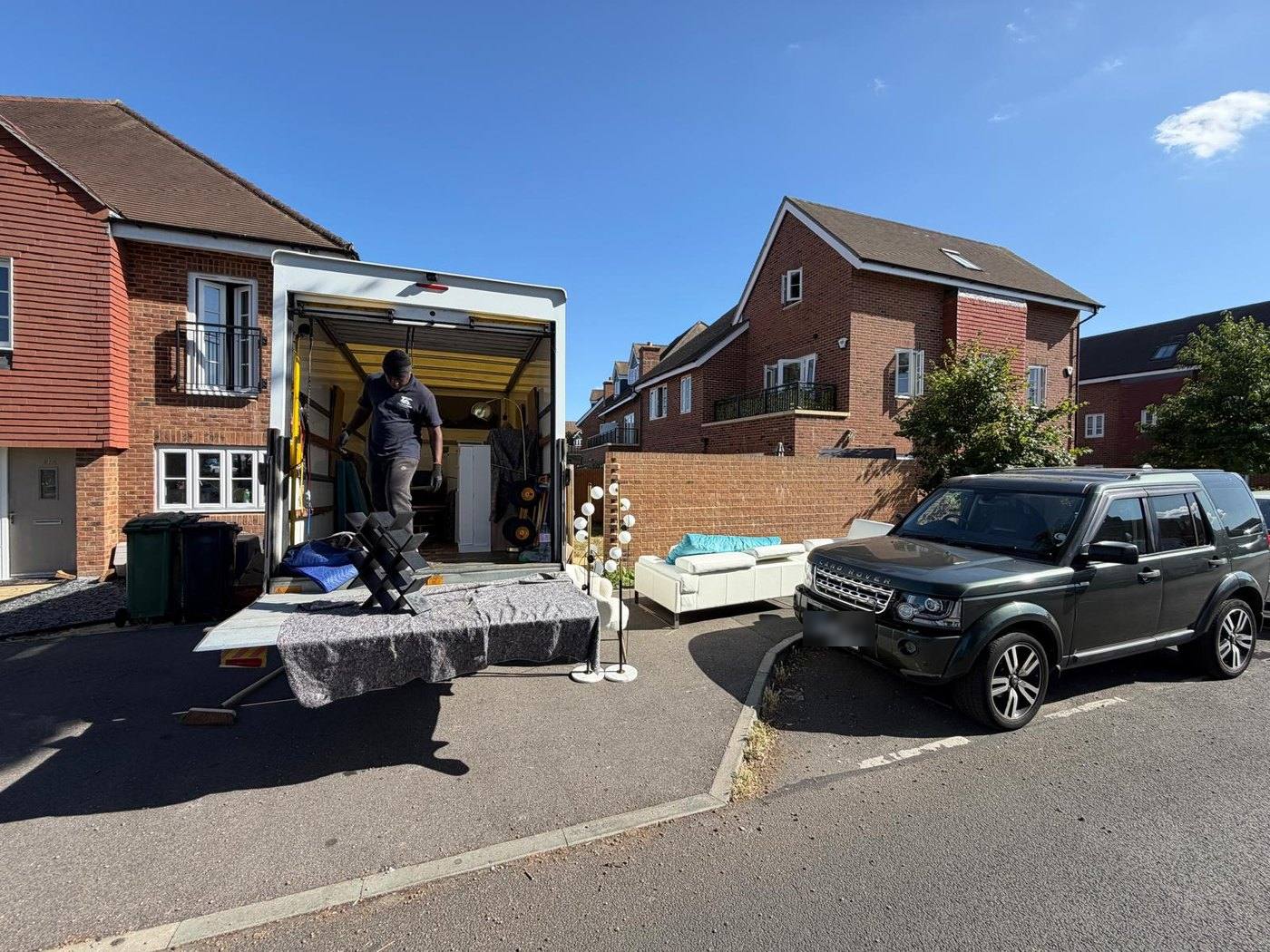 Taylor & Chang removal van loading outside a residential property